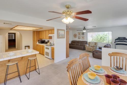 a kitchen and living room with a table and chairs at Quaint Bullhead City Getaway about 2 Mi to River! in Bullhead City
