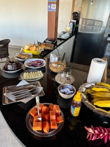 a buffet with a bunch of food on a table at Sintonia com o Mar in Angra dos Reis
