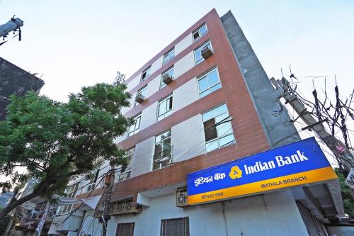 a building with a sign in front of it at Hotel O Plus One Hotel Residency in New Delhi