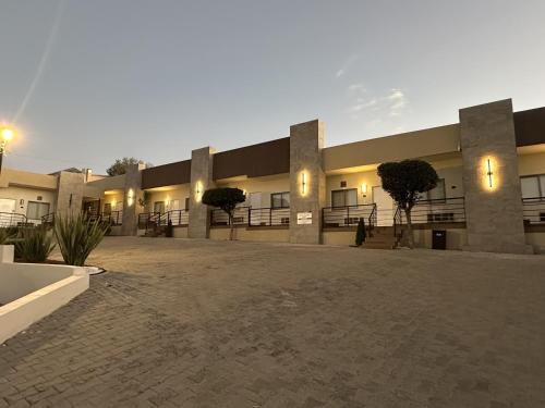a large building with lights on the side of it at Best Western Cumbres Inn Cd. Cuauhtemoc in Cuauhtémoc