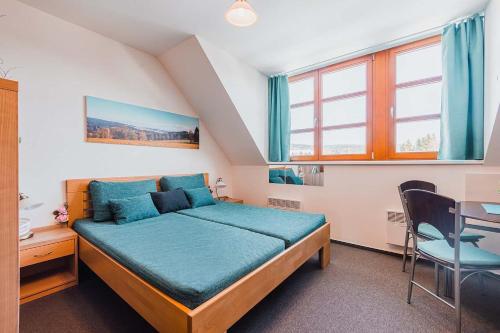 Postel nebo postele na pokoji v ubytování Skiapartma - Říčky v Orlických horách