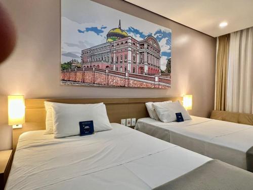 Ένα ή περισσότερα κρεβάτια σε δωμάτιο στο Linda Suite Blue Tree Premium Manaus