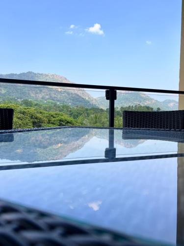 a view from a window of a mountain view at Avanee Hotel in Mawanella