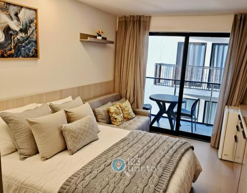 Postel nebo postele na pokoji v ubytování Beach Haus By 123Quarto hospedagem