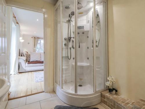a bathroom with a shower and a sink at Freshwinds in Market Drayton