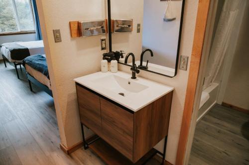 a bathroom with a sink and a mirror at Adrift Hotel in Long Beach