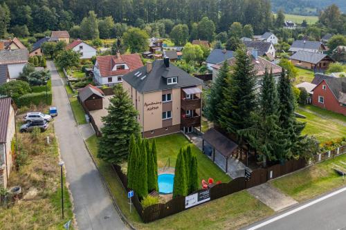 an aerial view of a house with a pool at Apartmany Agatha in Loučná nad Desnou