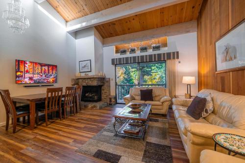 a living room with a couch and a table at Creekside Chalet Stay for 6 in Kings Beach