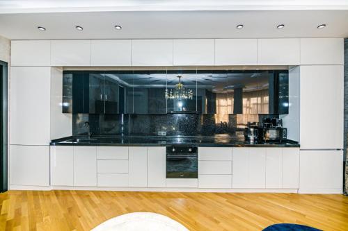 Kjøkken eller kjøkkenkrok på VIP Apartment LEOPARD