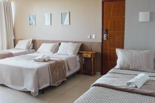 Postel nebo postele na pokoji v ubytování Pousada Xerxes