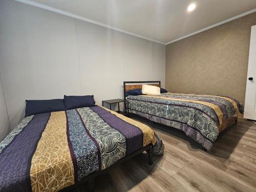 a bedroom with two beds in a room at West Battle Lake w Lake Views in Battle Lake