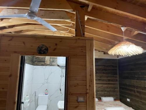 a ceiling in a room with a toilet and a bathroom at Ohel in Mullini i Danit