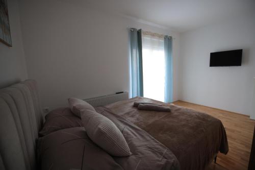 Ένα ή περισσότερα κρεβάτια σε δωμάτιο στο Stan na dan Luna