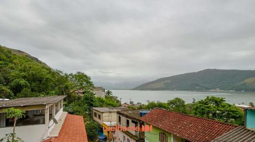 a view of a town with a river and buildings at Casa em Mangaratiba com 3 suites e Vista Mar in Mangaratiba