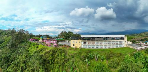 an aerial view of a building on a hill at Hotel Entre Lomas in Santa Rosa de Cabal