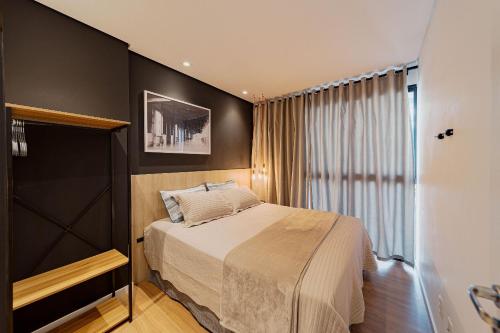 Ένα ή περισσότερα κρεβάτια σε δωμάτιο στο Wi-Fi Rápido Piscina Conforto Localização HIG807