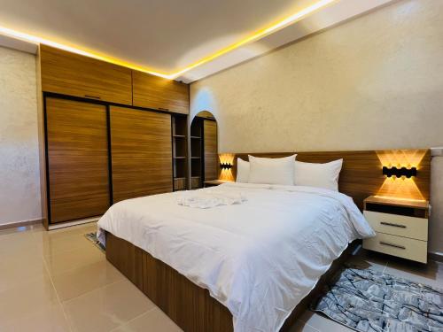a bedroom with a large bed in a room at Heart of Dakhla Residence in Dakhla