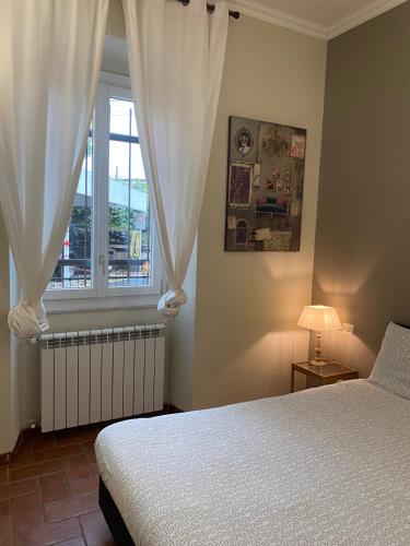 a bedroom with a bed and a window at La Pieve di Luca in La Spezia