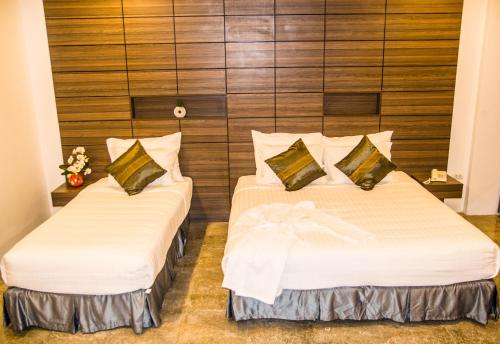 Katil atau katil-katil dalam bilik di Family Boutique Hotel