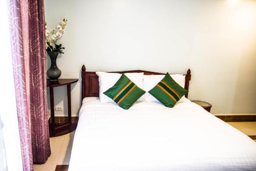 Katil atau katil-katil dalam bilik di Family Boutique Hotel