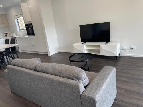 TV a/nebo společenská místnost v ubytování Coastal Retreat