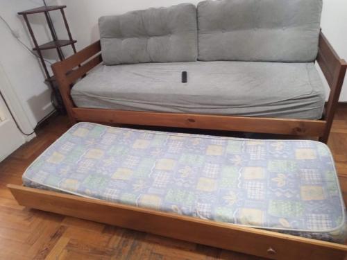 a bed frame with a mattress on top of it at 6 personas playa grande con reservación previa in Mar del Plata