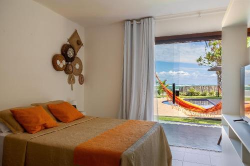 Postel nebo postele na pokoji v ubytování Casa Ilha| beira mar, piscina aquecida, 4 suítes