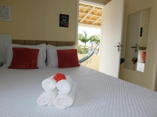 En eller flere senge i et værelse på Pousada Luzes de Geribá