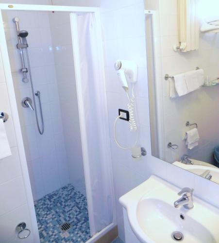 a bathroom with a shower and a sink at Hotel Mare Blu -- boutique in Pineto
