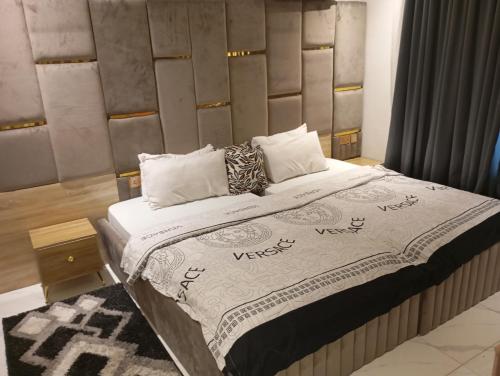 a bedroom with a large bed in a room at Happy place in Port Harcourt
