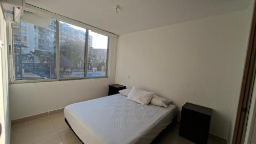 Postel nebo postele na pokoji v ubytování Peñazul La Aldea Condominio en Ricaurte Campestre - Apartamento con vista a piscinas