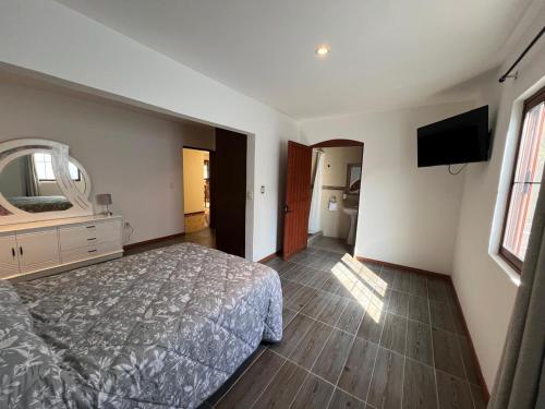 Ένα ή περισσότερα κρεβάτια σε δωμάτιο στο Casa Bigosh