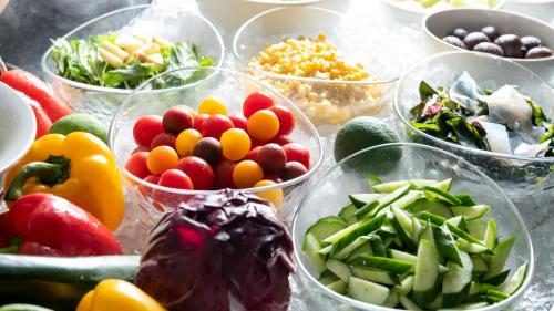 a bunch of bowls filled with different types of vegetables at ANA Crowne Plaza Hiroshima by IHG in Hiroshima