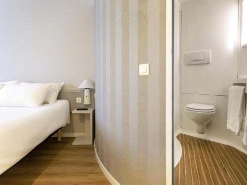 Postel nebo postele na pokoji v ubytování Ibis Valencia Alfafar