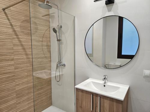 a bathroom with a sink and a mirror at Hotel Rural Mirador de Jubrique in Jubrique