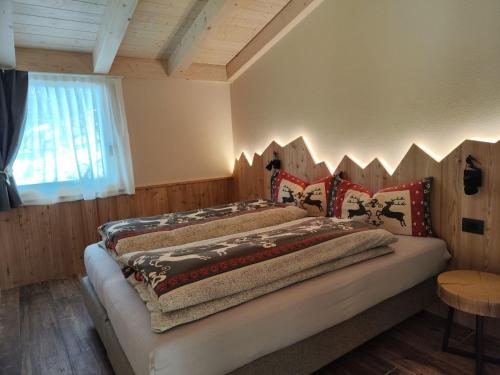 Postel nebo postele na pokoji v ubytování Camping Val di Sole