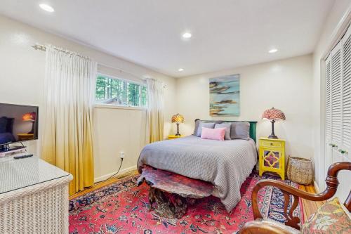 a bedroom with a bed and a red rug at Colorado Pines Retreat in Lake Valley