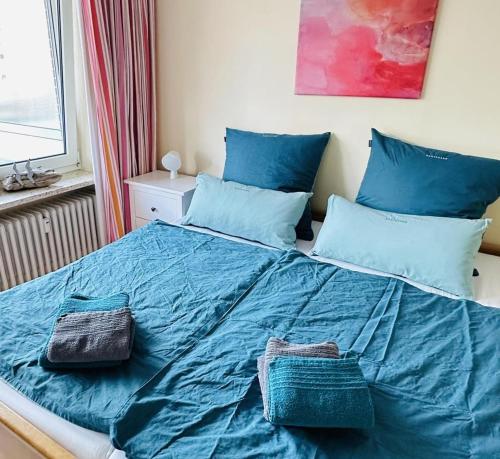 Postel nebo postele na pokoji v ubytování Lüttje Mima im Haus Abert