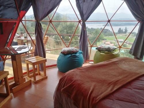 Postel nebo postele na pokoji v ubytování Glamping Cabaña San Martin