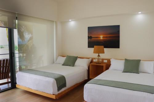 Postel nebo postele na pokoji v ubytování Acuaski