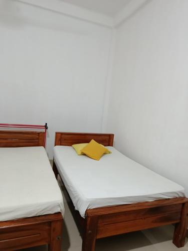 Ένα ή περισσότερα κρεβάτια σε δωμάτιο στο Yala Safari Green Hotel One