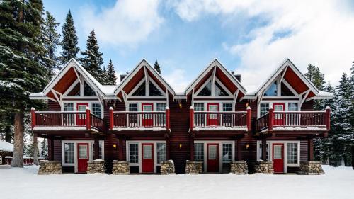 a large house in the snow at Paradise Lodge and Bungalows in Lake Louise
