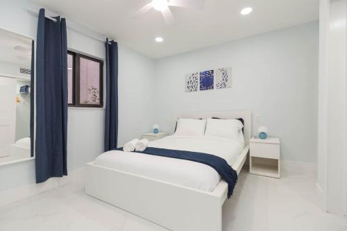 Ένα ή περισσότερα κρεβάτια σε δωμάτιο στο Clearwater Bliss Apartments 2