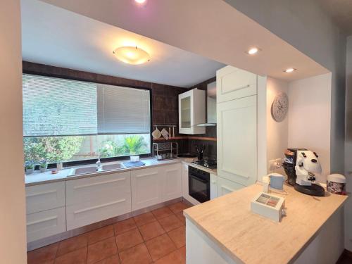 Kuchyň nebo kuchyňský kout v ubytování Donna Rosa