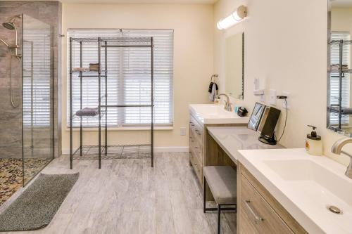 a bathroom with two sinks and a shower at Lyles Peaceful Creekside Home Hot Tub and Fire Pit in Lyles