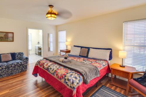 a bedroom with a bed with a cat sitting on it at Lyles Peaceful Creekside Home Hot Tub and Fire Pit in Lyles