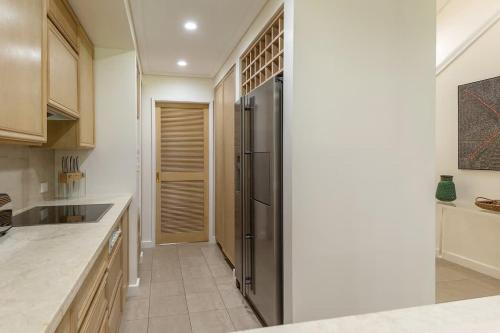 Kuchyň nebo kuchyňský kout v ubytování Port Douglas Mirage Villa 424