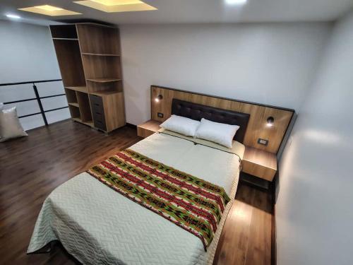 a bedroom with a large bed in a room at Hotel Casa Santiago in Estación El Salto