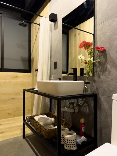a bathroom with a sink and a mirror at Upscale 2BR 2BA Apt w incredible Mountain Views in Oaxaca City