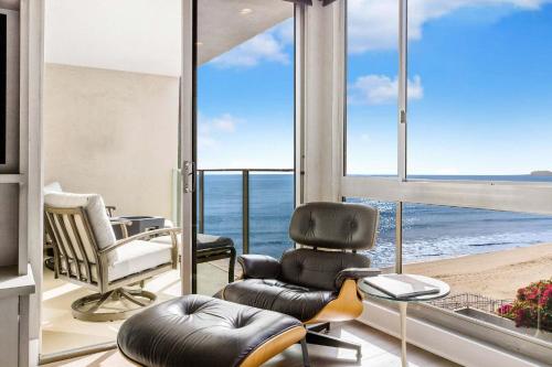a living room with a view of the ocean at Aquareve in Malibu Beach